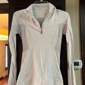 Lululemon grey and white quarter zip, small hole on the sleeve